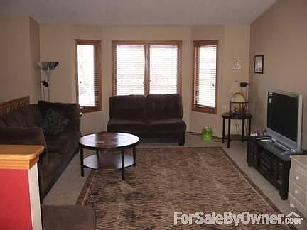Bay window and open living area
						:
						Newer carpet upstairs and vaulted ceilings