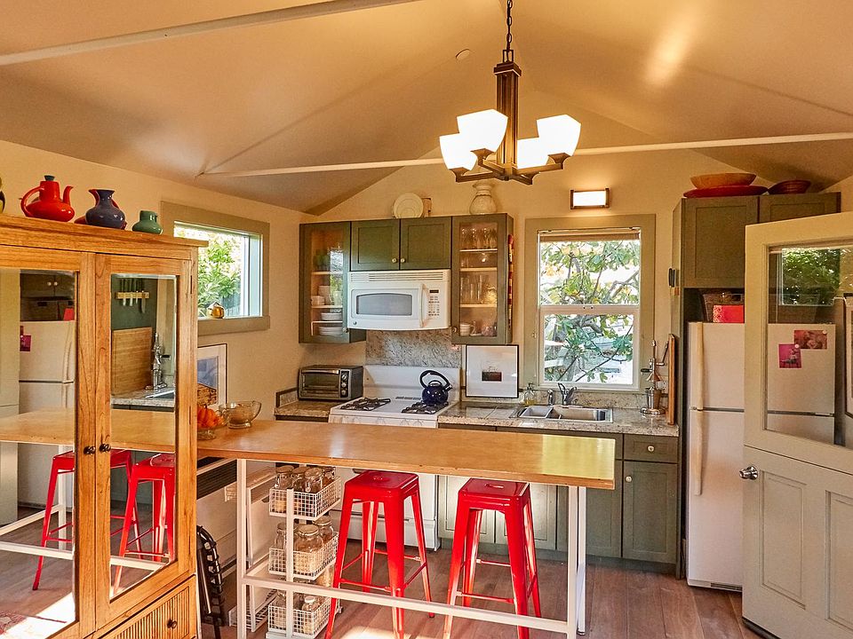 Cottage kitchen. Shown with prior tenant's furnishings.