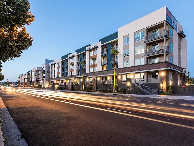 Warm lighting enhances the charm of this cityside residence.