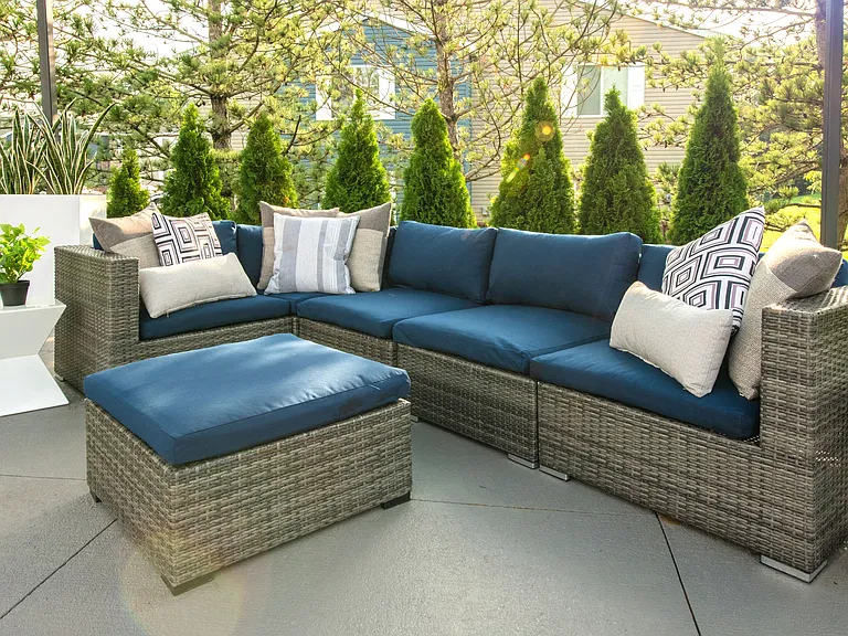 Unwind on our outdoor patio with plush lounge seating and ottoman for ultimate relaxation, professionally operated by Highlands Vista Group.