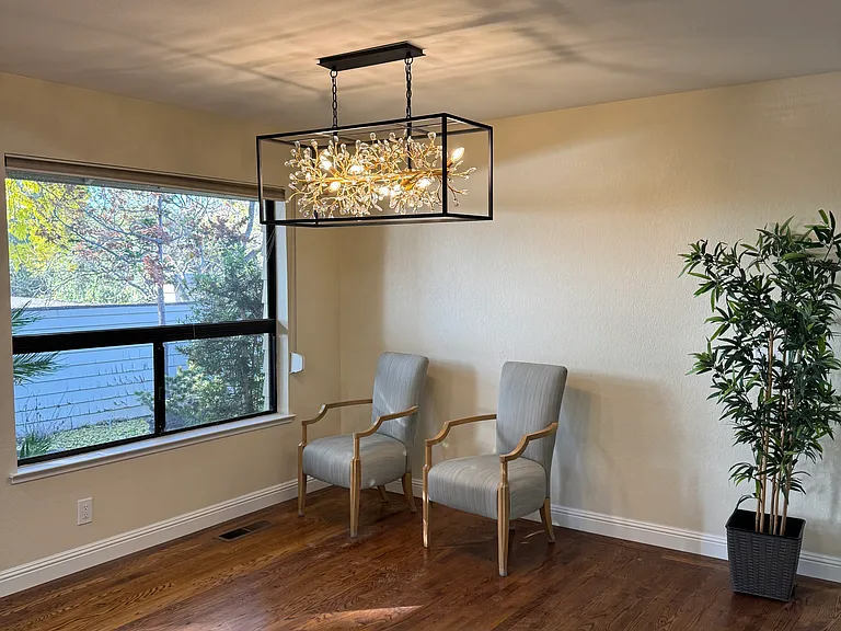 Beautiful chandelier with views of yard
