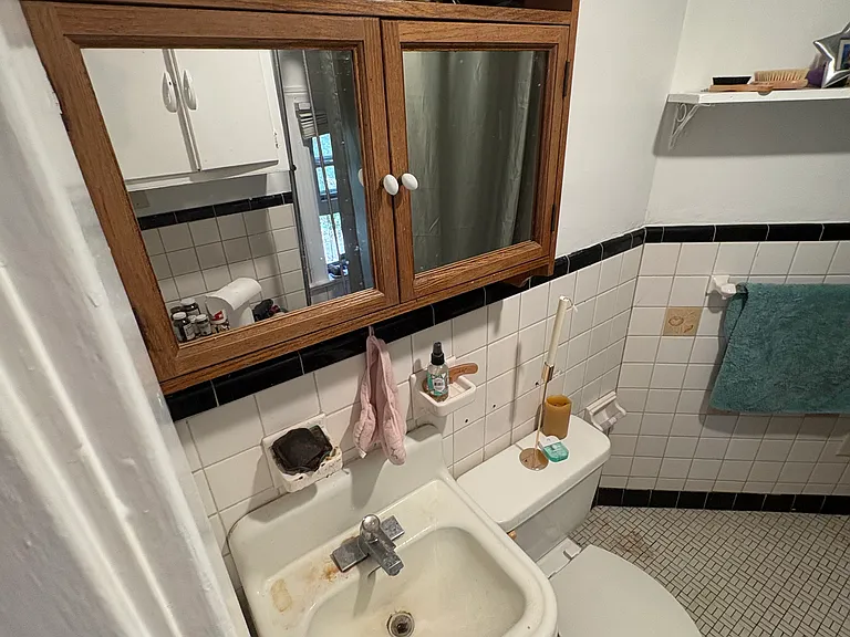 bathroom with tiled lower walls