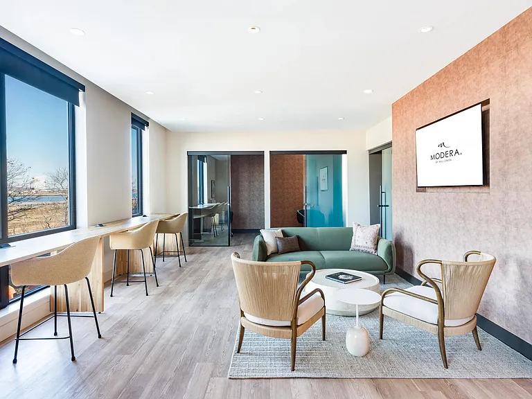 A refined coworking lounge with quiet nooks, natural light, and spaces designed for focus or collaboration.
