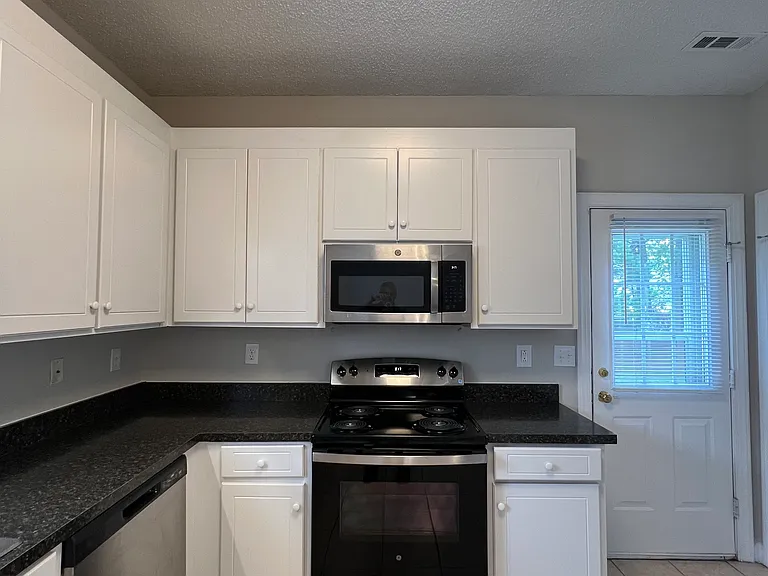KITCHEN WITH STAINLESS STEEL STOVE, REFRIGERATOR WITH ICE MAKER, STOVE, MICROWAVE, DISHWASHER!!