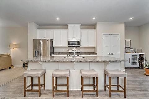 Main floor kitchen with large granite island