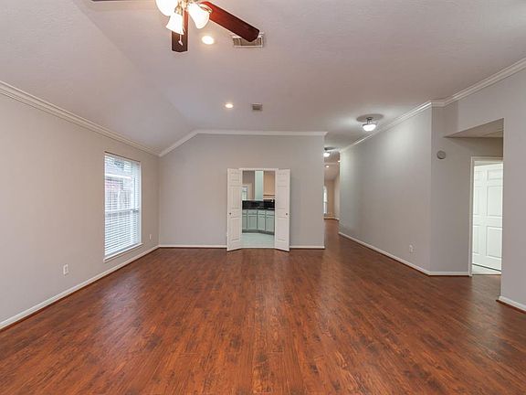 This view is from the entry area where you'll find the formal living and dining areas. It's open to the kitchen and den area whi