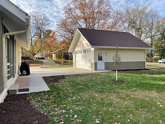 Large detached garage fully insulated and heated with electric car charger outlet. Driveway off of Lusk Ave.