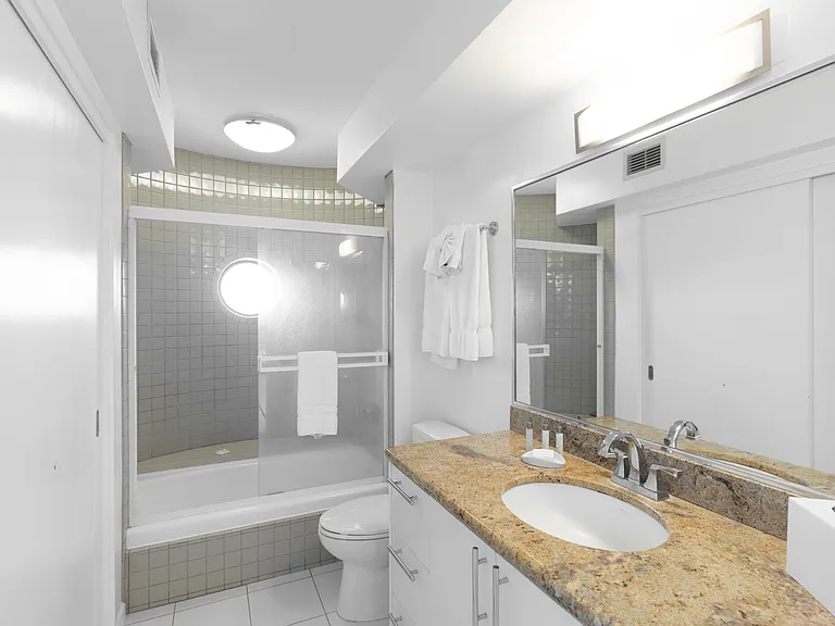 Large vanity and ample bathroom storage space