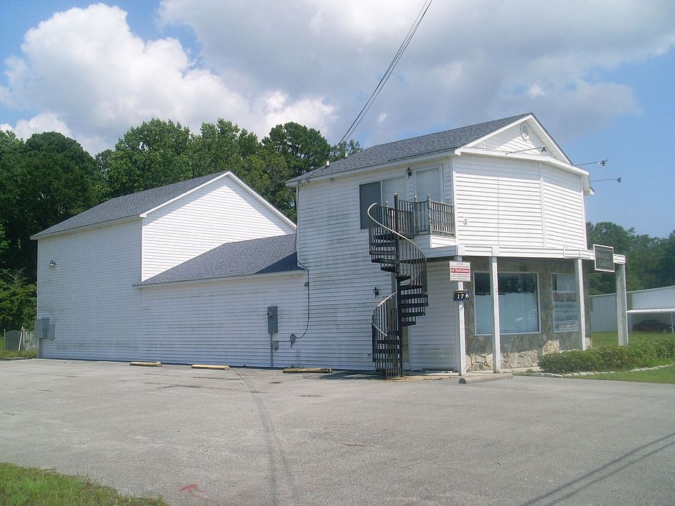 Side of building with access to on site apartment