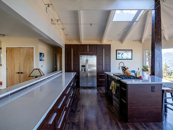 Open concept kitchen with skylights