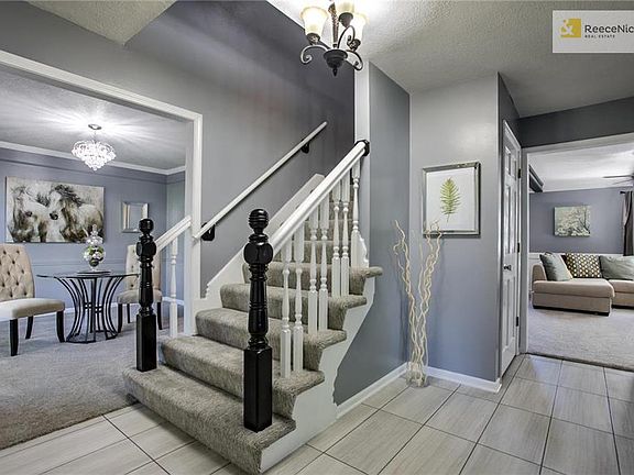 View from Entry!  NEW Designer Carpet on Stairs, NEW Carpet Thru-Out! New Vinyl Tile Flooring!