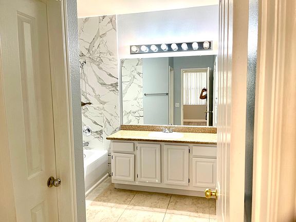 Primary bathroom & French door to walk in closet