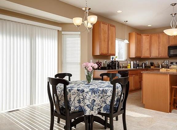 Breakfast room has slider to deck and private back yard