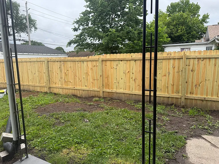 Fenced back yard with 1 car garage and additional parking