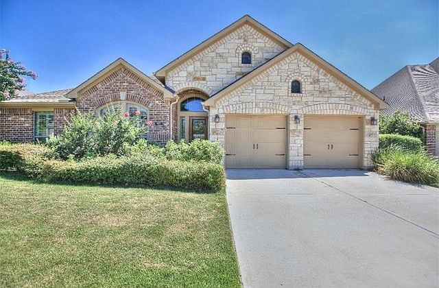 This beautiful home has established landscaping and tons of curb appeal.