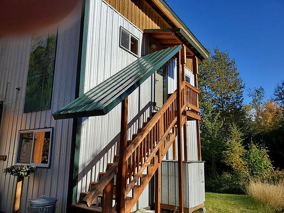Covered access to upstairs Unit 2.