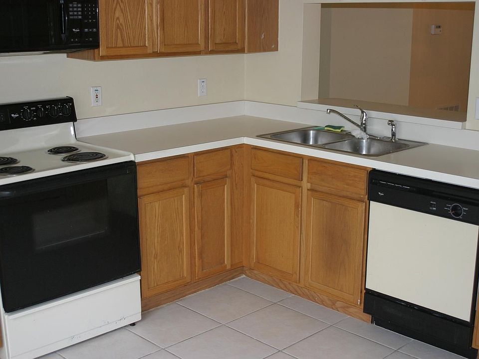 Spacious Kitchen w/ Laundry Area.Pass-thru window to Dining Room.  