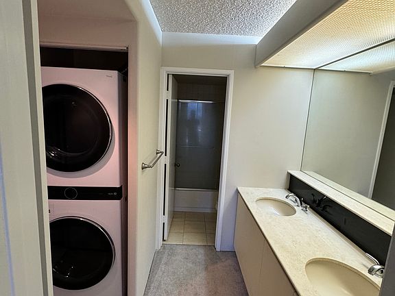 Vanity, washer dryer and bathroom