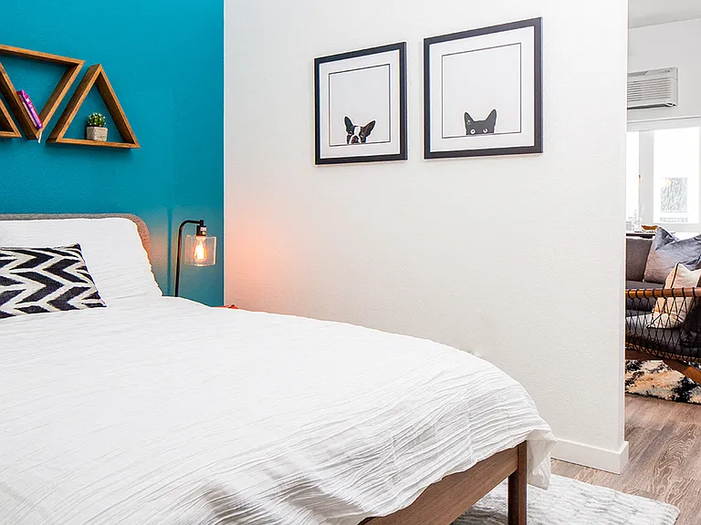 Spacious and cozy bedroom with ample natural light.