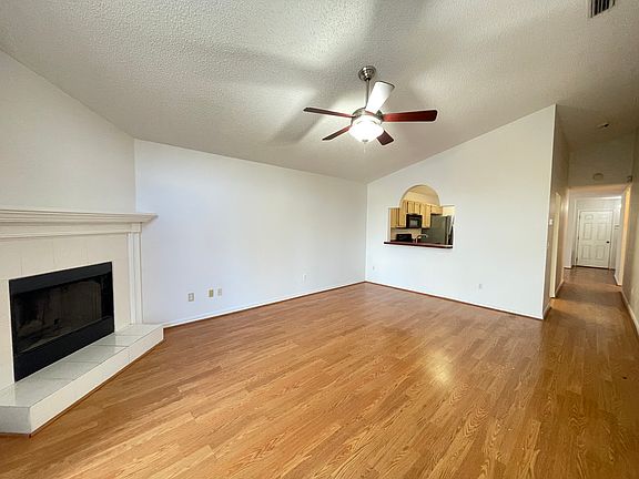 Living area to front door and kitchen