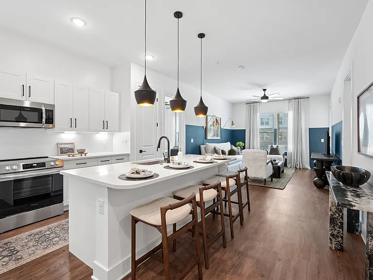 Kitchen Island with Seating Space and View into Living Room
