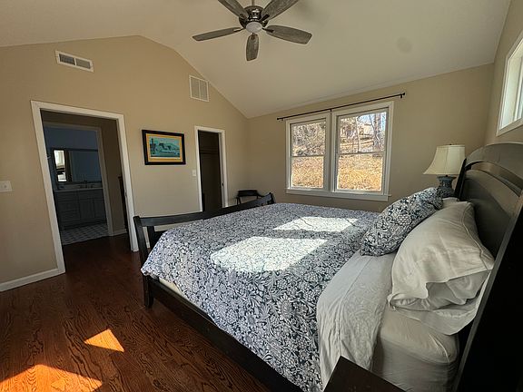 Another view of primary bedroom. Not pictured is a smart TV.