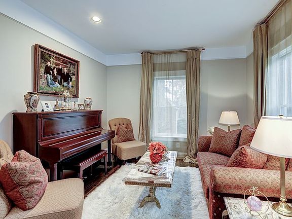 Living Room with rich trim, large windows, recessed light