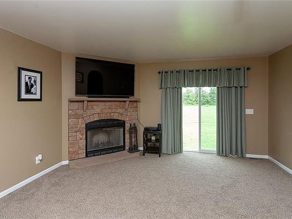 Living Room with wood burning fireplace.