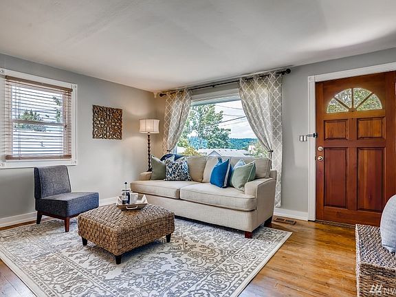 Spacious bright  living room with hardwood floors and big picture window!