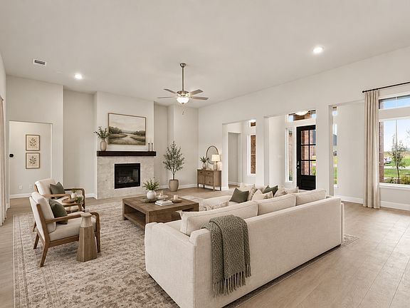 Virtually staged living room in a transitional ranch style home by Kindred Homes