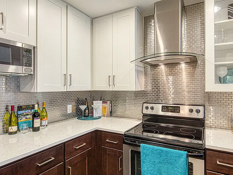 Two Tone Designer Cabinetry with Glass Fronts