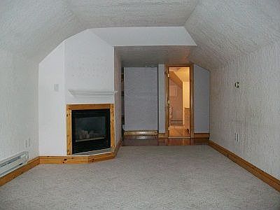 Living Room - Neutral carpet in living room & bedroom.Tile i