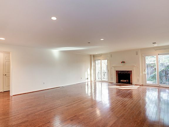 LIVING ROOM WITH VIEW INTO BEDROOM AREA