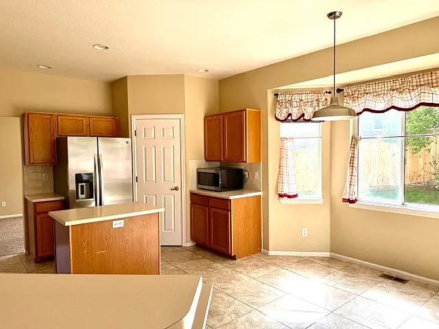 Kitchen with a large pantry.