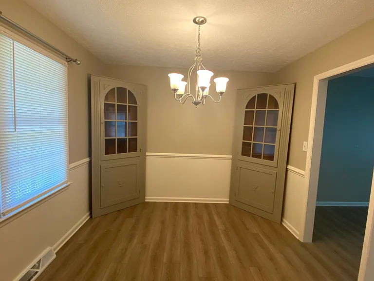 Dining room with corner storage cabinets / view from the kitchen