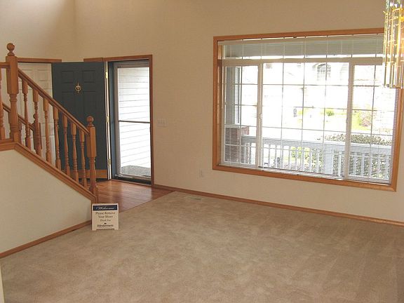 Formal living room and foyer with vaulted ceilings