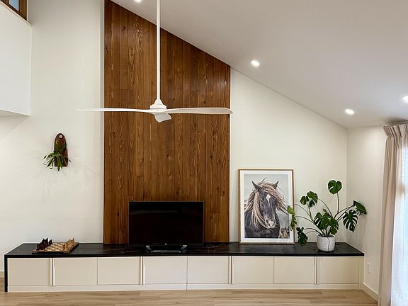 The beautiful cedar wall, long bench for display or seating. And not to mention, plenty of closed storage.