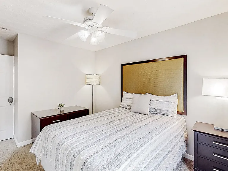 Cozy room with full bed, closet and storage area