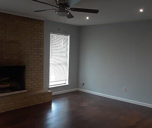 Living Room with fireplace and new floors
