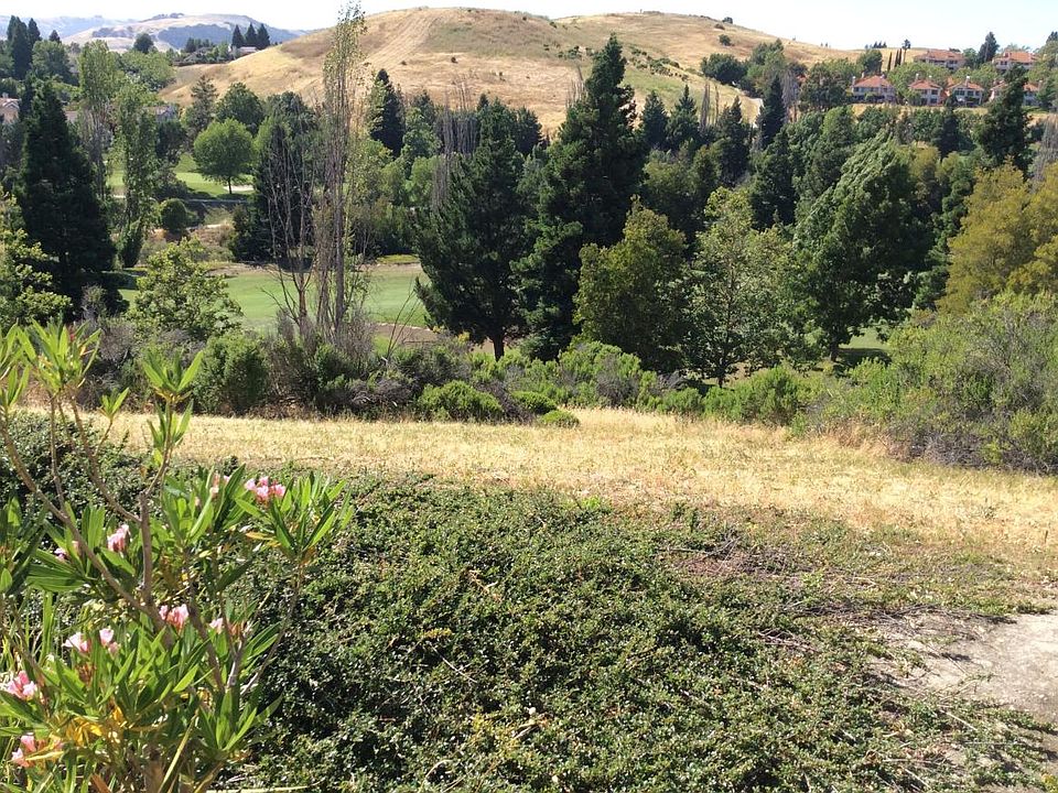 Balcony view of canyon, golf course and surrounding hills