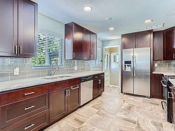 Kitchen with all major stainless steel appliances and garbage disposal included