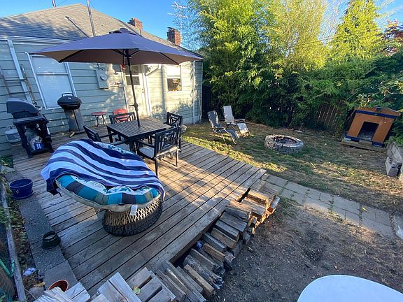 Backyard with spacious deck and fire pit