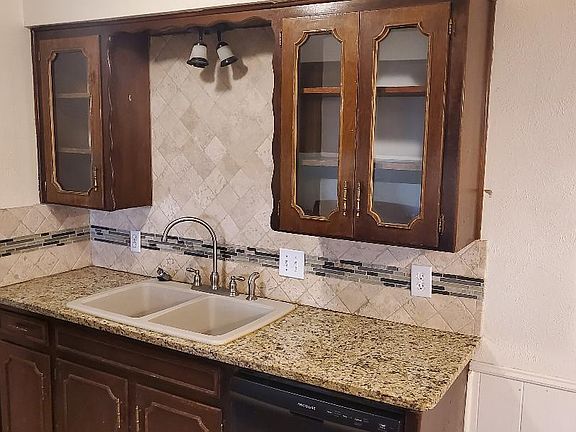 DEEP SINK W/ GRANITE COUNTERTOP & GLASS CABINETS