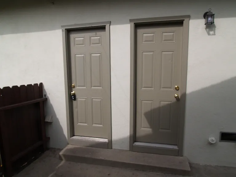 This unit has garage access across from kitchen door. Both front and back units have their own laundry hook ups. This unit has auto garage door opener, shelving for storage. Both units have parking in driveway with separate garage doors.