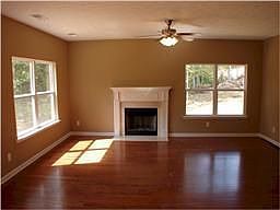 Great Room features hardwood floors and a fireplace