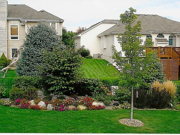 Professionally Planned and Installed
						:
						Large, beautifully Landscaped with Hedges, Flowers and a Gorgeous Red Maple