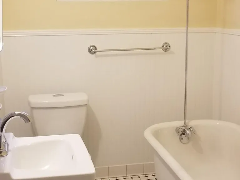 claw foot tub with shower a few shelves have been added for storage and we supplied a shower curtain