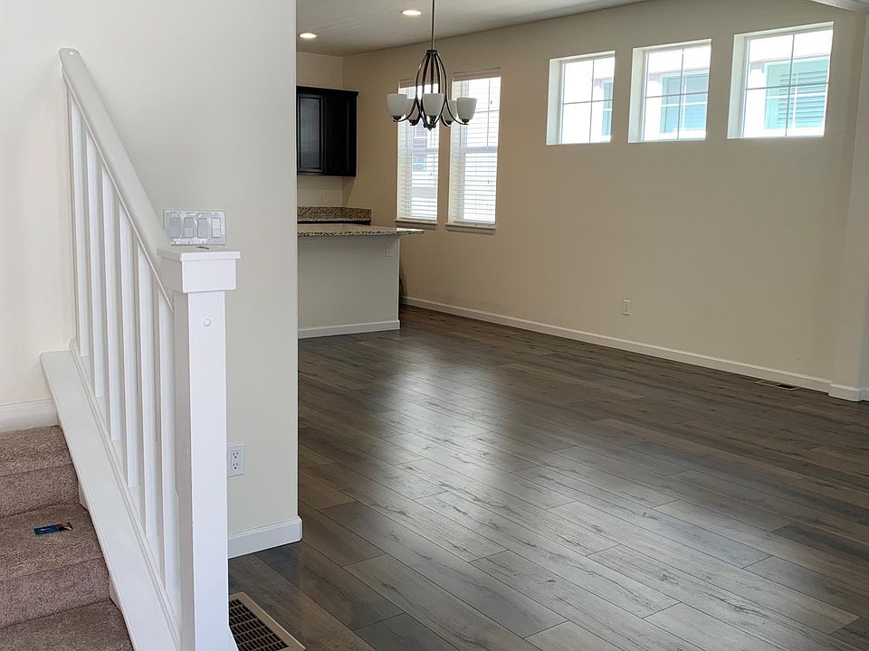 Just inside front door, hard surface floor on main, open family room, dining area & kitchen.