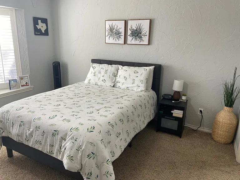Primary Bedroom - furnished with full size bed, tall dresser, desk, chair, & nightstand. Decor items not included. Private space for occupant of primary bedroom.