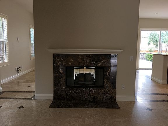 Dual-side living room / family room fireplace